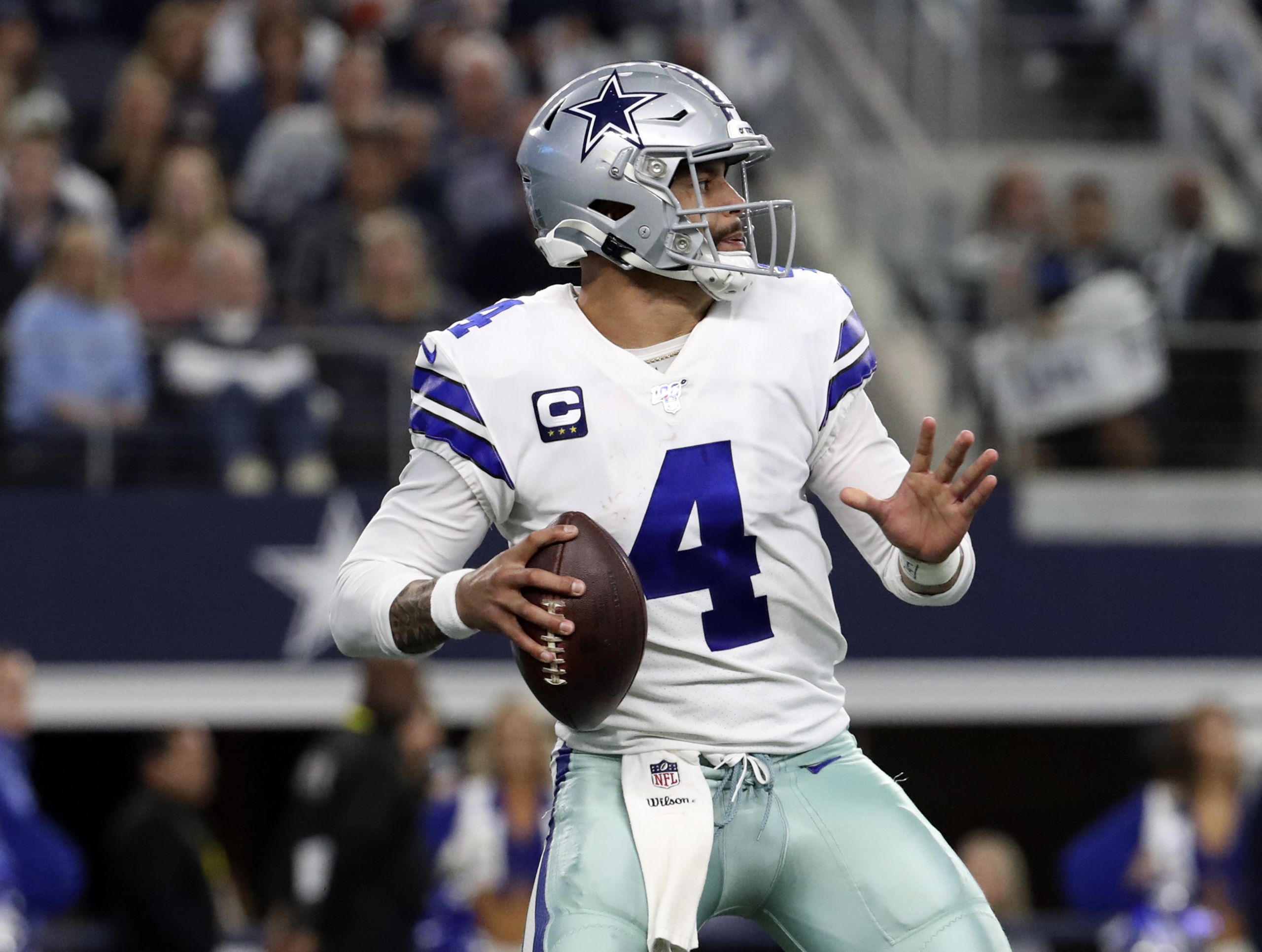 Dak Prescott throwing a pass in 2019