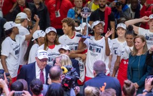 women_holding_trophy