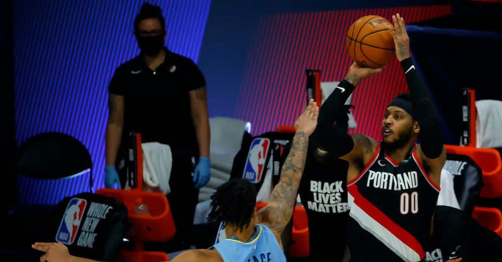 Carmelo Anthony shoots a three-pointer.