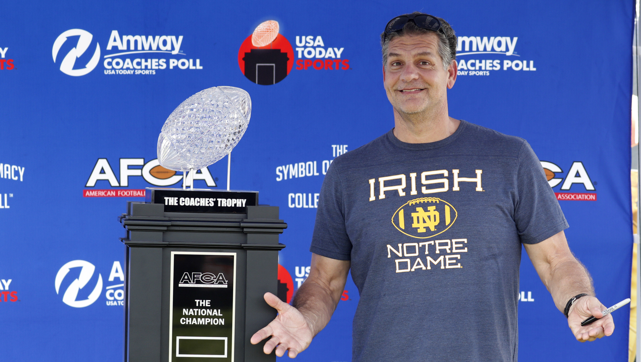 golic_sr_standing_by_trophy