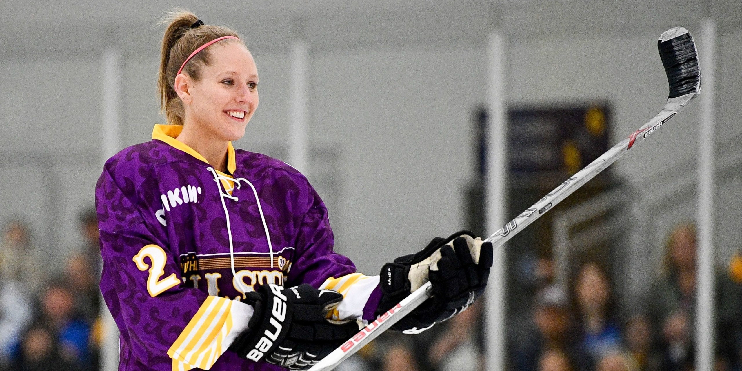 woman_holding_hockey_stick