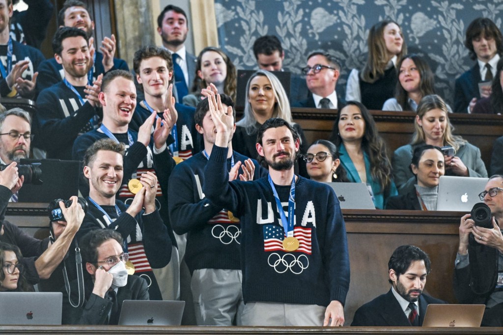 Feb 24, 2026; Washington, DC, USA; The United States Olympic Men’s Ice Hockey Team, Connor Hellebuyck in front, as President Donald J. Trump delivers the first State of the Union address of his second term to a joint session of Congress in the House Chamber of the United States Capitol in Washington on Tuesday
