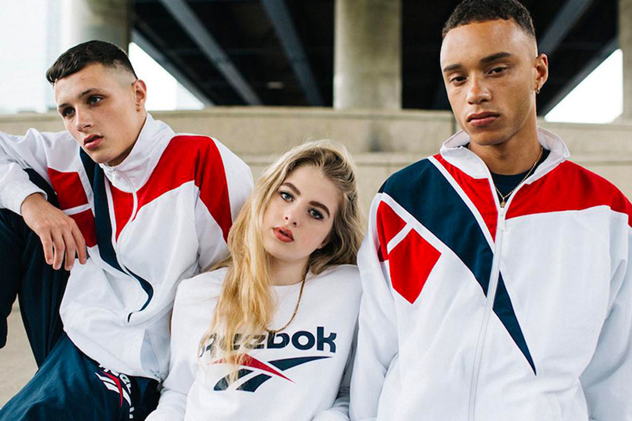 three_people_posing_in_reebok