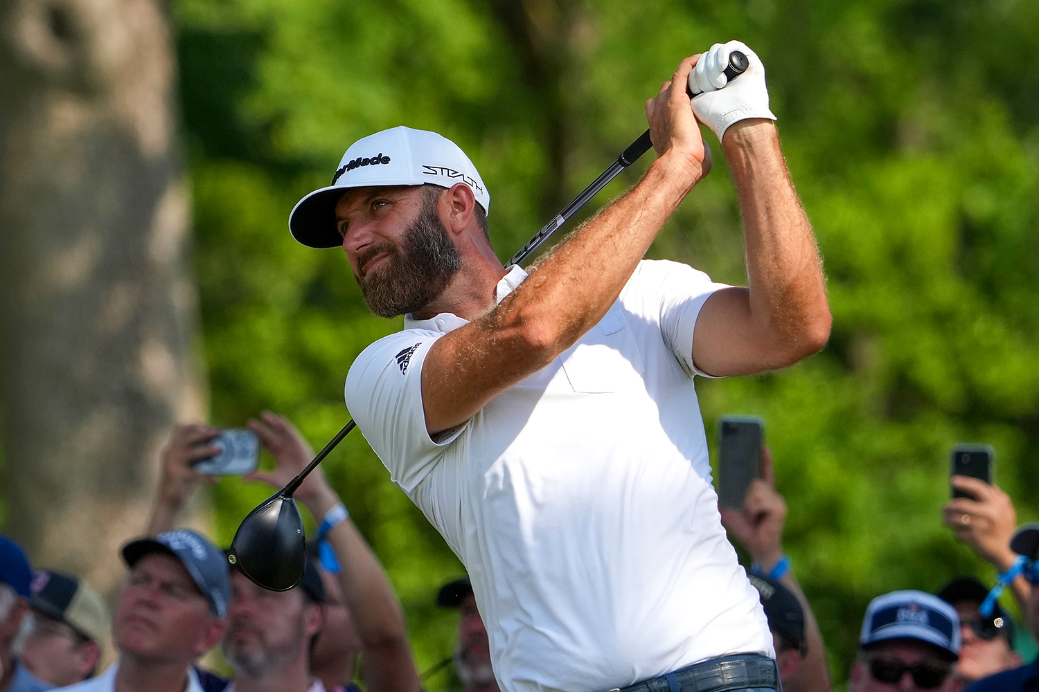 Dustin Johnson hits a drive.