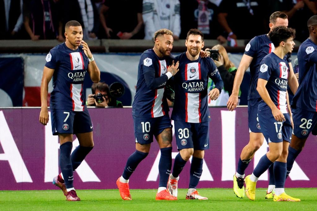 PSG players Messi, Neymar, and Mbappe celebrate with teammates after scoring goal