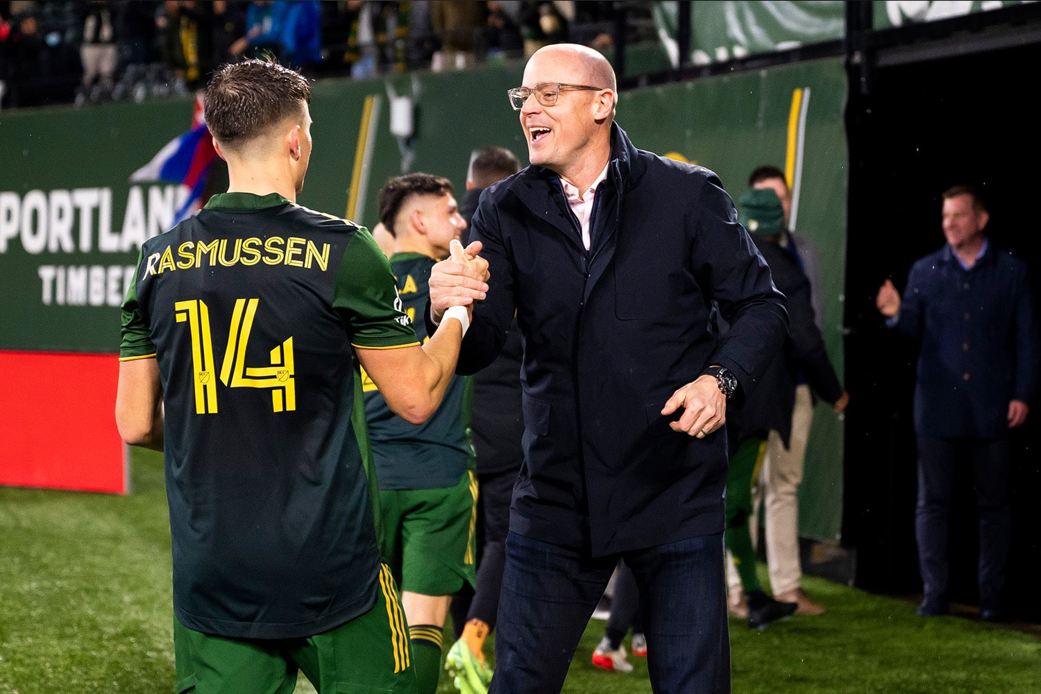 Portland Timbers and Thorns owner Merritt Paulson embraces Timbers player after game