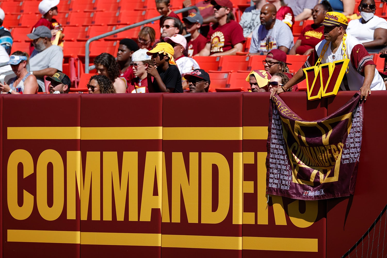 Washington Commanders fans watch team while inside stadium