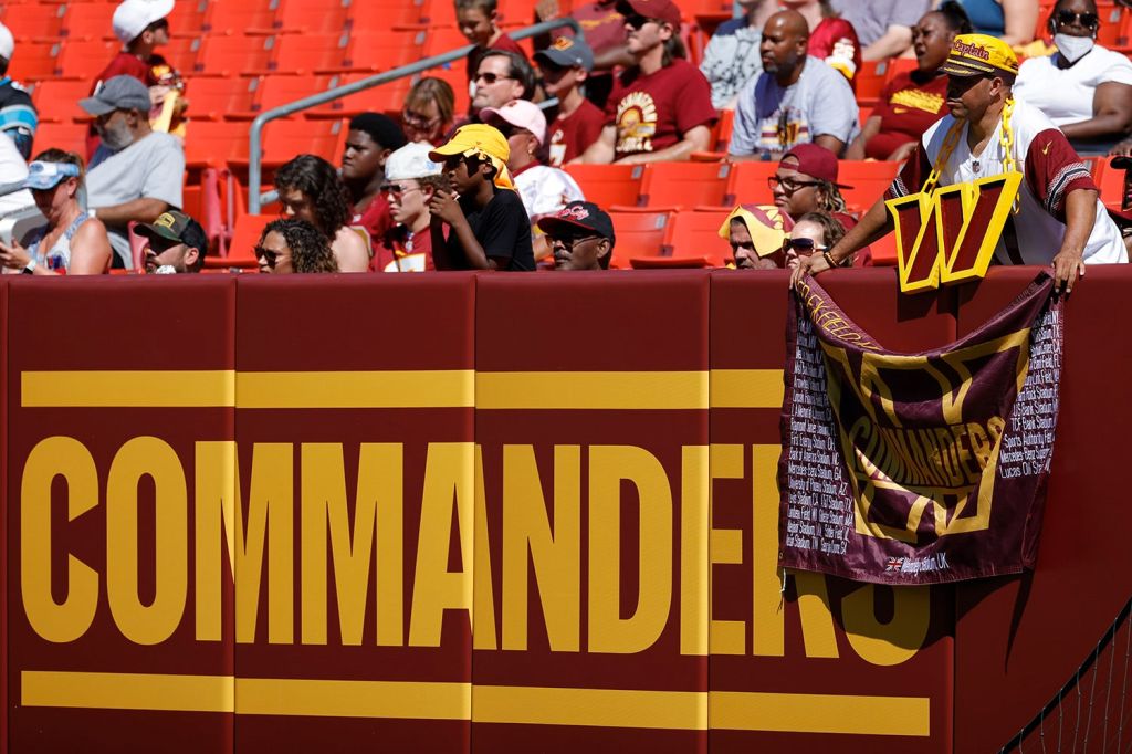 Washington Commanders fans watch team while inside stadium