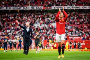 Manchester United striker Cristiano Rolando and manager Erik Ten Hag wave to crowd after match