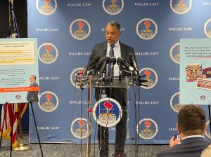 Washington, D.C. Attorney General Karl Racine speaks to media after filing law suit against Washington Commanders owner Dan Snyder