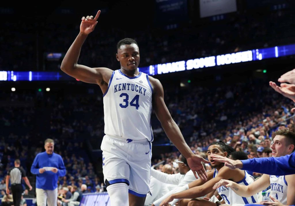 University of Kentucky guard Julius Mays celebrates with teammates on side line