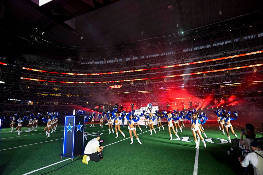 Dallas Cowboys cheerleaders perform at half-time of NFL game