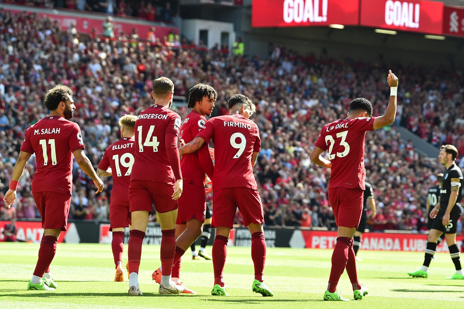 Liverpool players celebrate after scoring a goal