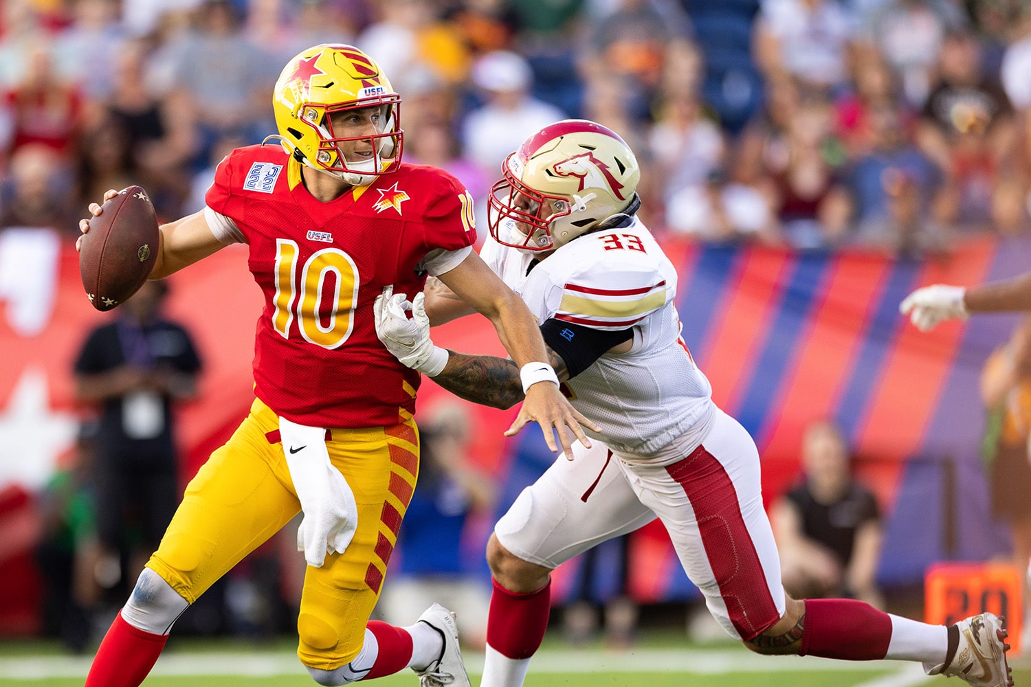 Quarterback of the Philadelphia Stars, a team in the USFL, escapes a tackle