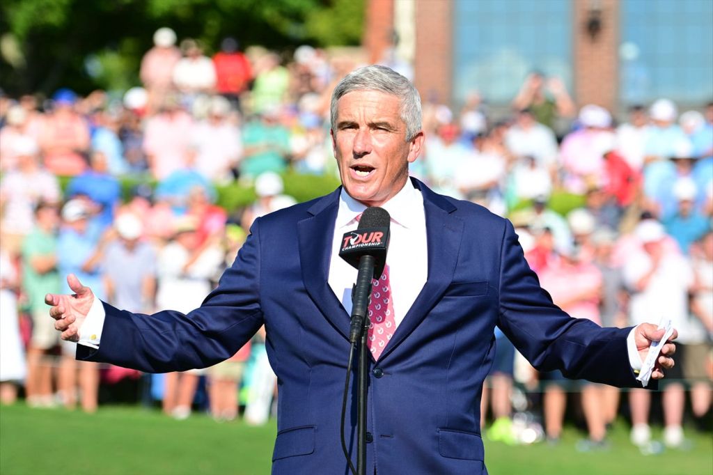 PGA Tour Commissioner Jay Monahan speaks in front of crowd