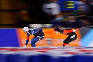 Speed skaters race against one another in Winter Olympic events