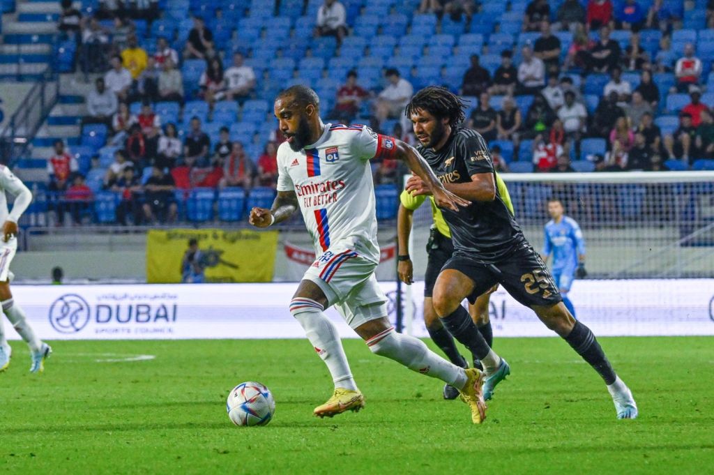 Olympique Lyon striker Alexandre Lacazette skips past Arsenal defender