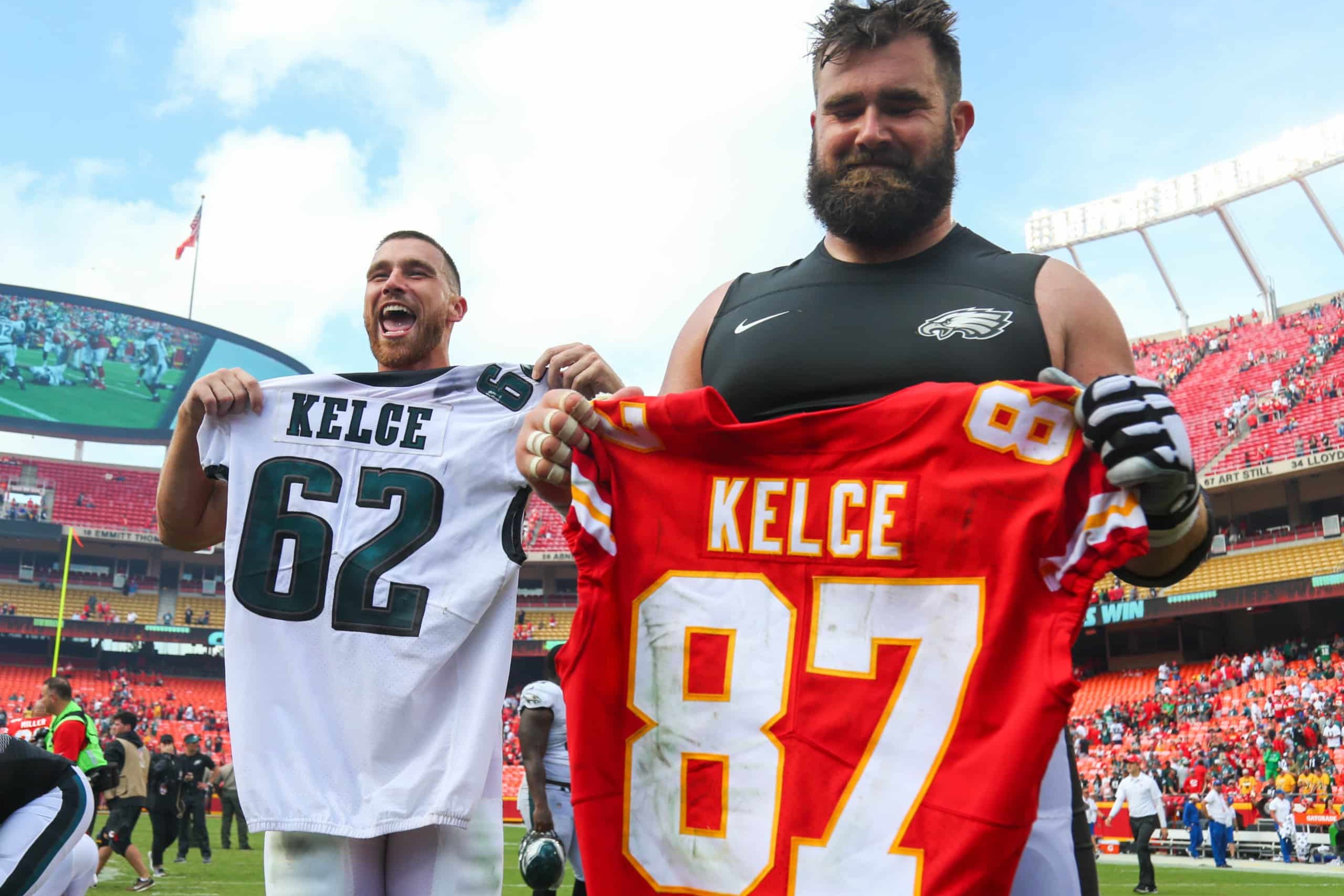 Brothers Travis and Jason Kelce trade jerseys and pose for photos after game