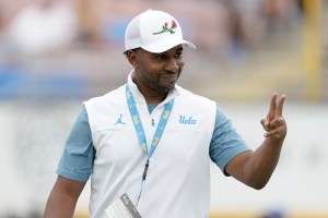 UCLA athletic director Martin Jarmond on field before a game