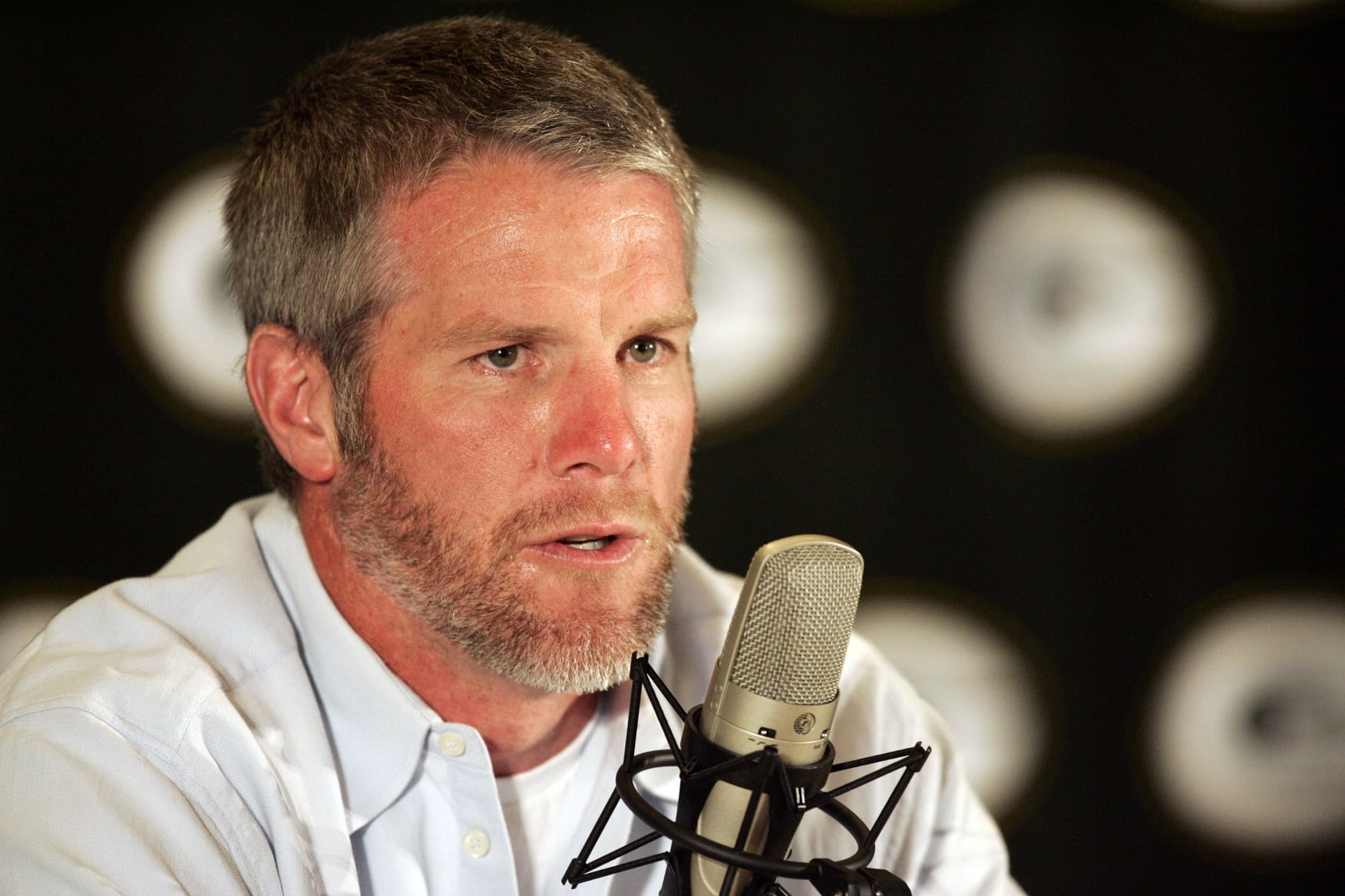 Brett Favre speaking to members of the media 