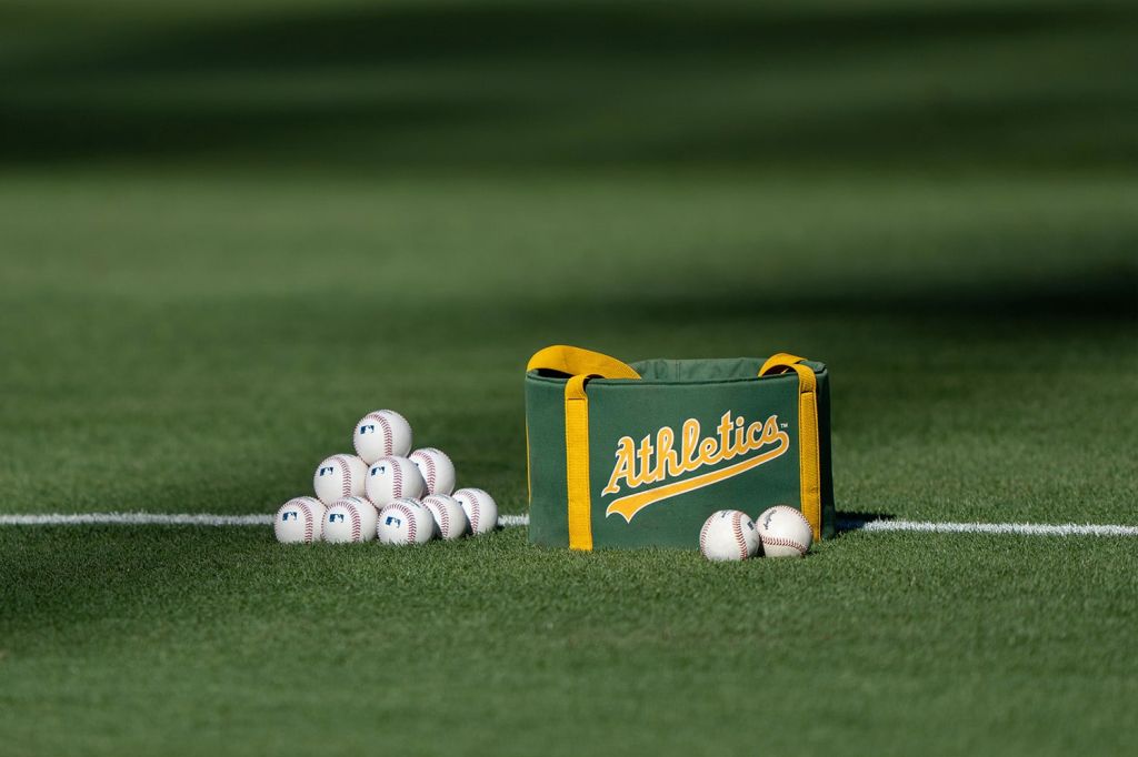 Baseball bag on field with Oakland Athletic's branding