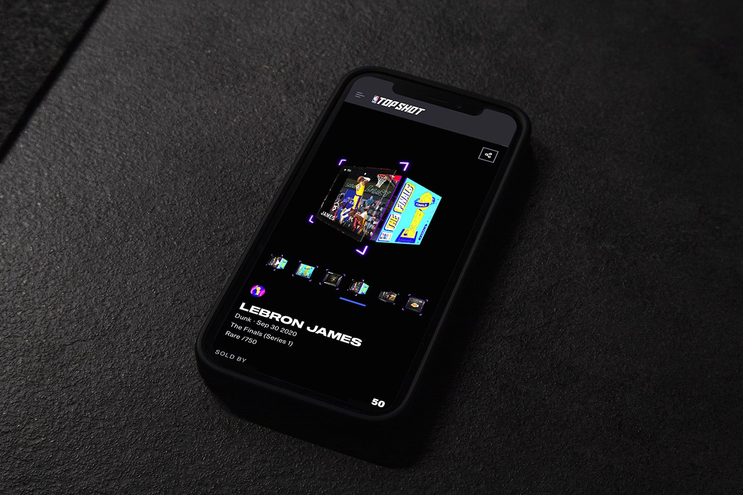 A NBA Top Shot collectible NFT of Lebron James is displayed on a phone.
