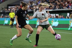 OL Reign defender Sofia Huerta and Portland Thorns forward Morgan Weaver during an NWSL preseason match.