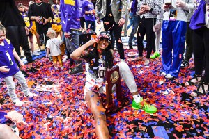 LSU forward Angel Reese celebrates after advancing to the NCAA Women's National Championship Final Four