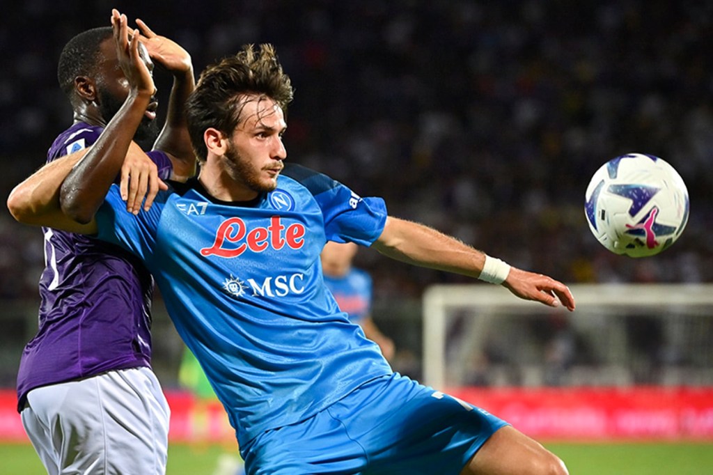 Napoli player Khvicha Kvaratskhelia fights for the ball during a Serie A match.