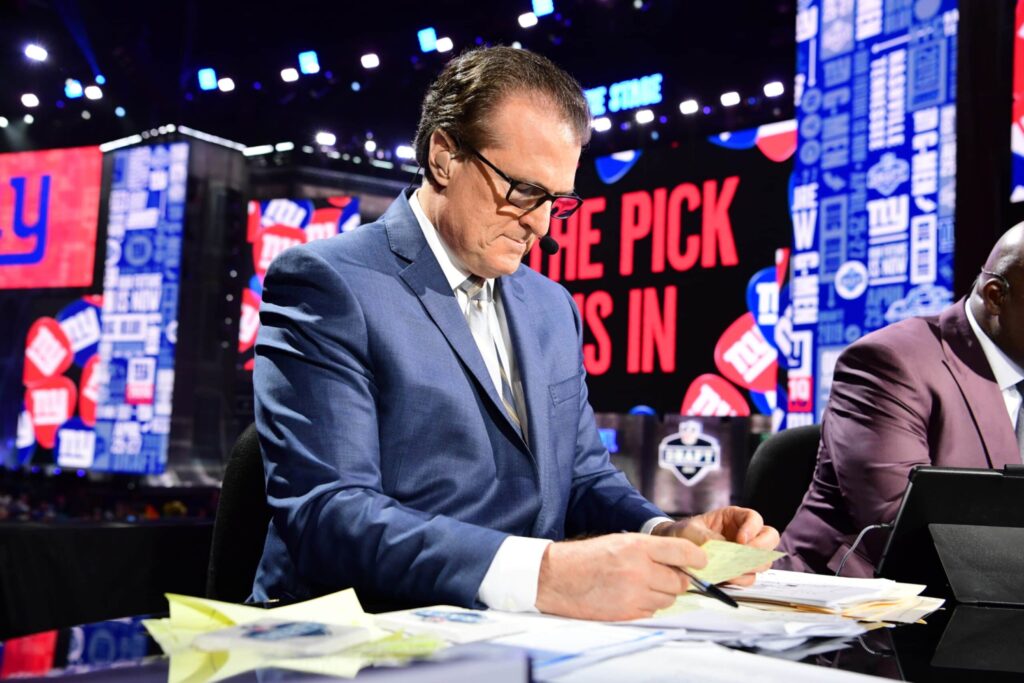 Mel Kiper Jr. reviews his notes during the NFL Draft.