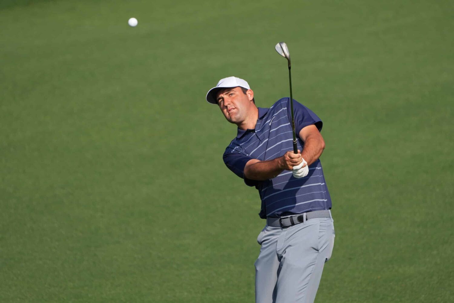 Scottie Scheffler hits a shot during a practice round for the Masters at Augusta National.