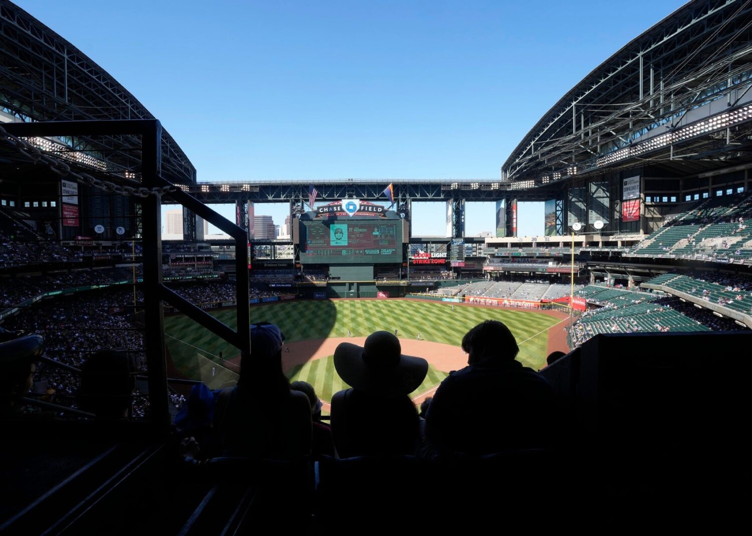 Fans watch the Arizona Diamondbacks and the Los Angeles Dodgers play with the roof opened at Chase field during the seventh inning.