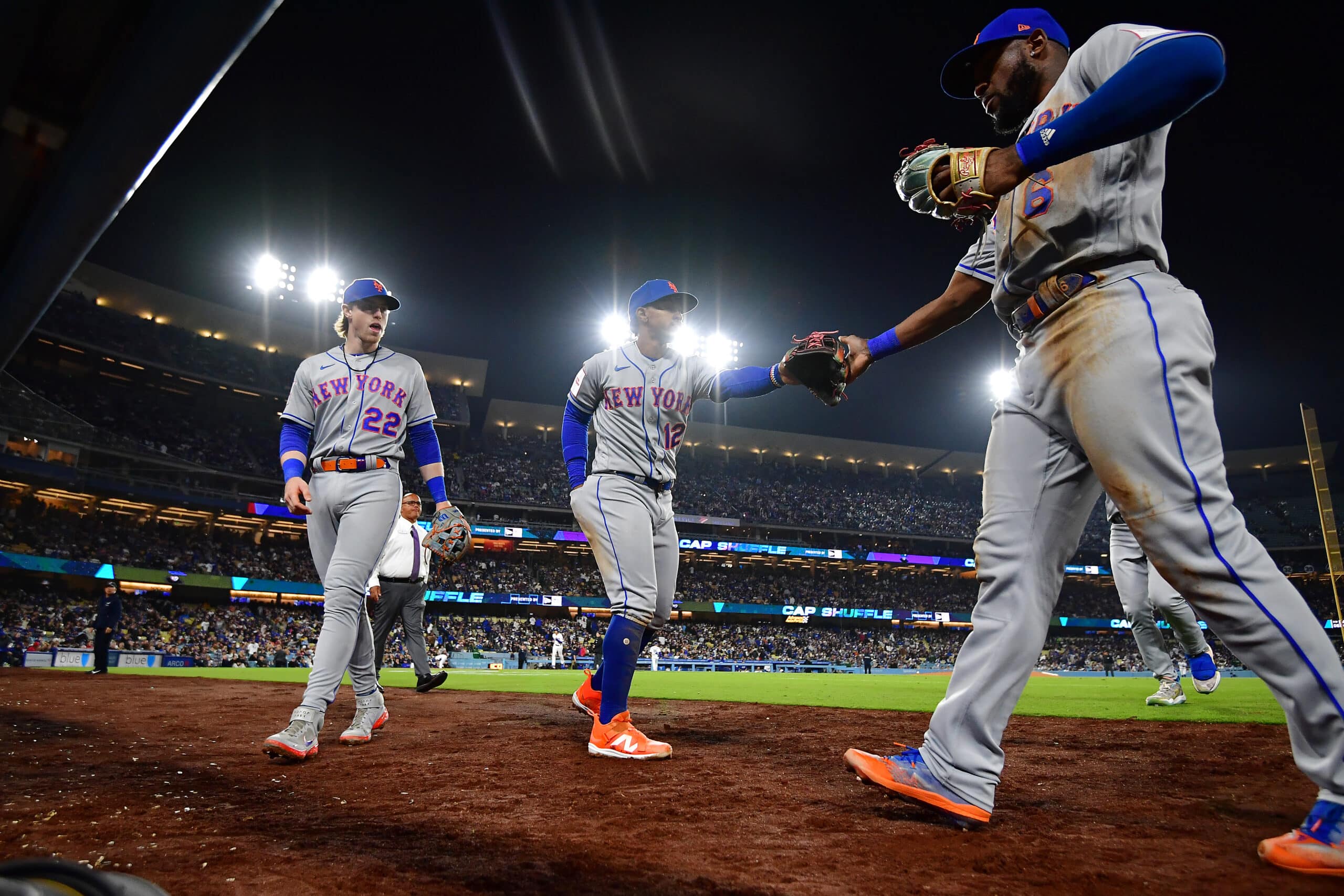 Through 12 home dates, the Los Angeles Dodgers lead at 48,418 per game.