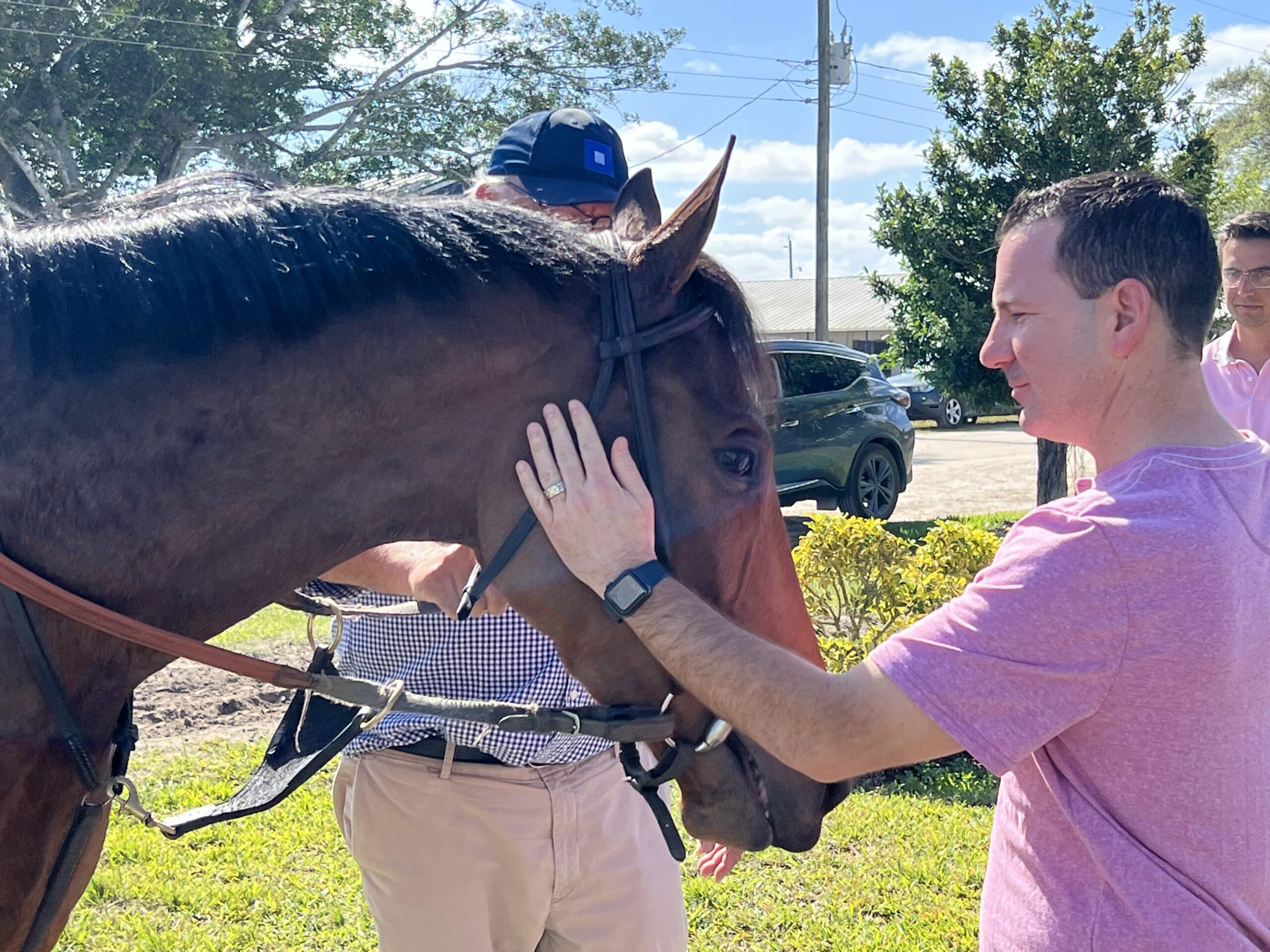 Ian Rapoport pets his filly Parnac.