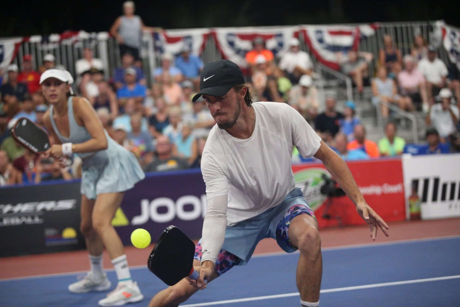 Parris Todd and Hunter Johnson playing pickleball mixed doubles.