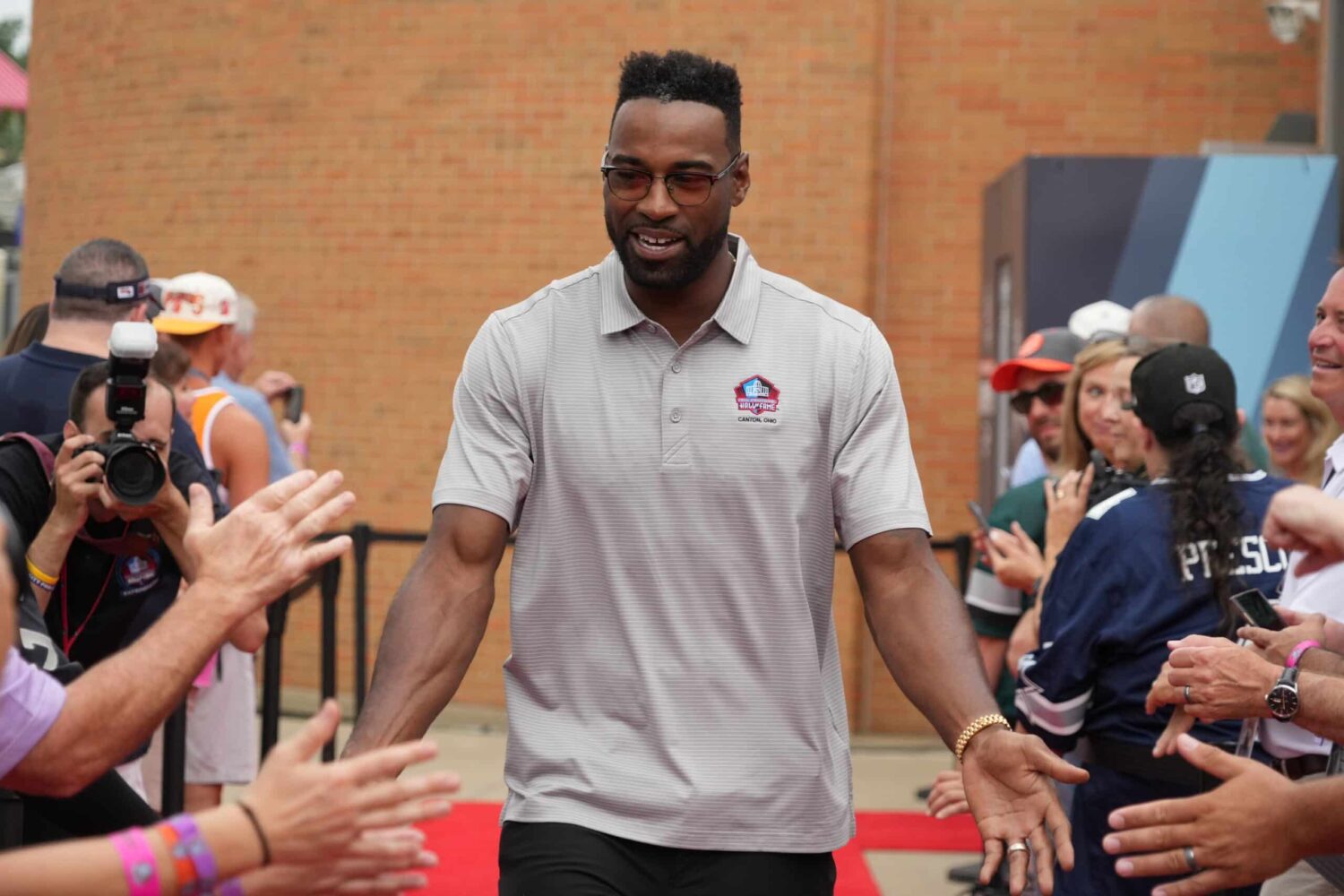 Calvin Johnson arrives on the red carpet during the Pro Football Hall of Fame Class of 2022 Enshrinement at Tom Benson Hallof Fame Stadium.