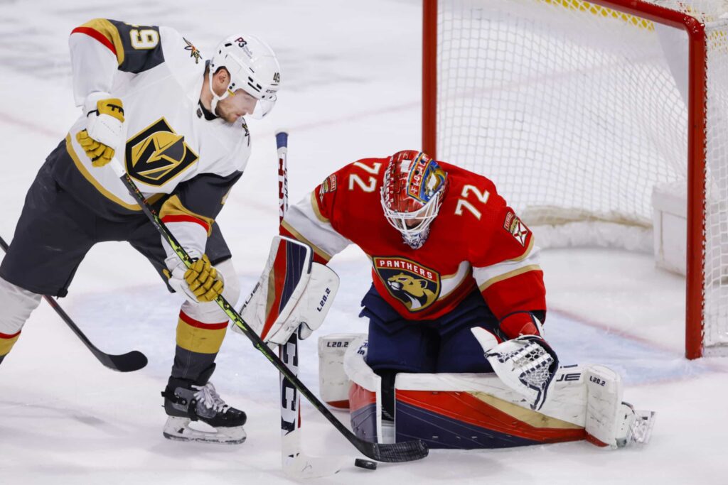 Florida Panthers goaltender Sergei Bobrovsky blocks a shot from Vegas Golden Knights center Ivan Barbashev during a game at FLA Live Arena.