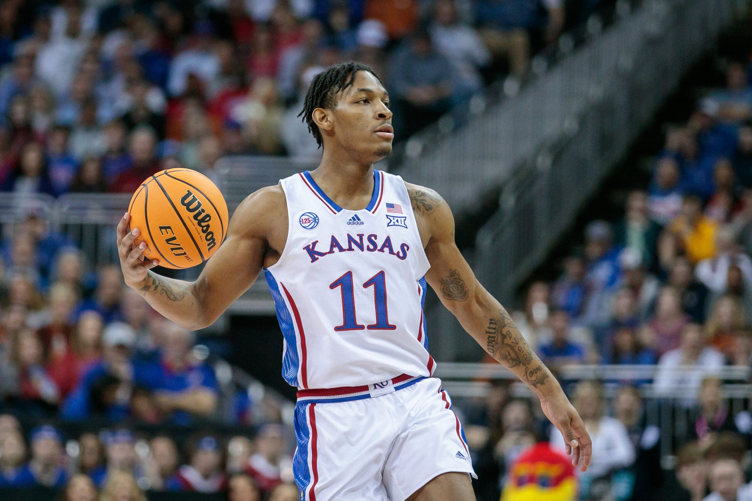 Mar 11, 2023; Kansas City, MO, USA; Kansas Jayhawks guard MJ Rice (11) sets the play during the first half against the Texas Longhornsat T-Mobile Center.