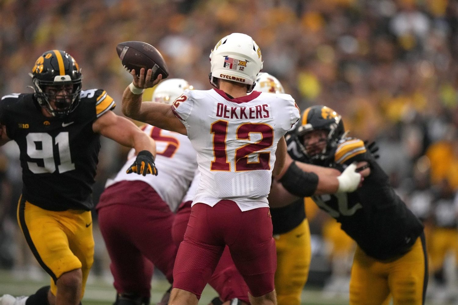 Iowa State quarterback Hunter Dekkers throws the ball during the Cy-Hawk Series football game against Iowa.