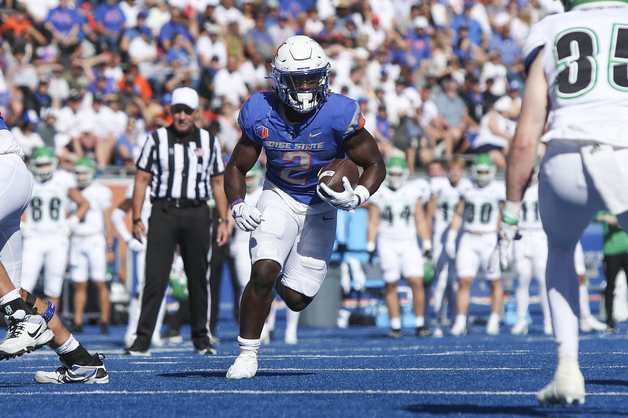 Boise State Broncos running back Ashton Jeanty (2) runs the ball against the North Dakota Fighting Hawks during the first half at Albertsons Stadium.