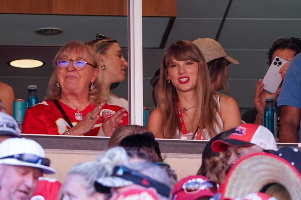 Taylor Swift reacts while sitting next to Donna Kelce watching the Kansas City Chiefs vs Chicago Bears game during the first half at GEHA Field at Arrowhead Stadium.