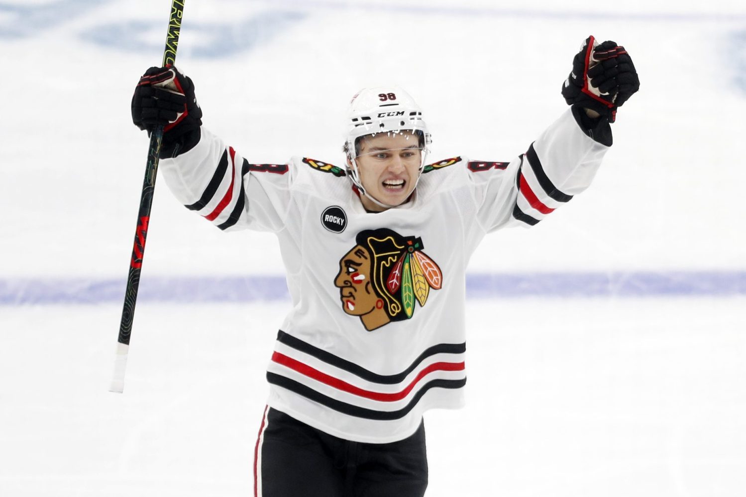 Chicago Blackhawks center Connor Bedard reacts to a goal by center Ryan Donato against the Pittsburgh Penguins during the second period at the PPG Paints Arena. Beard assisted on the goal to record his first NHL point in his league debut.