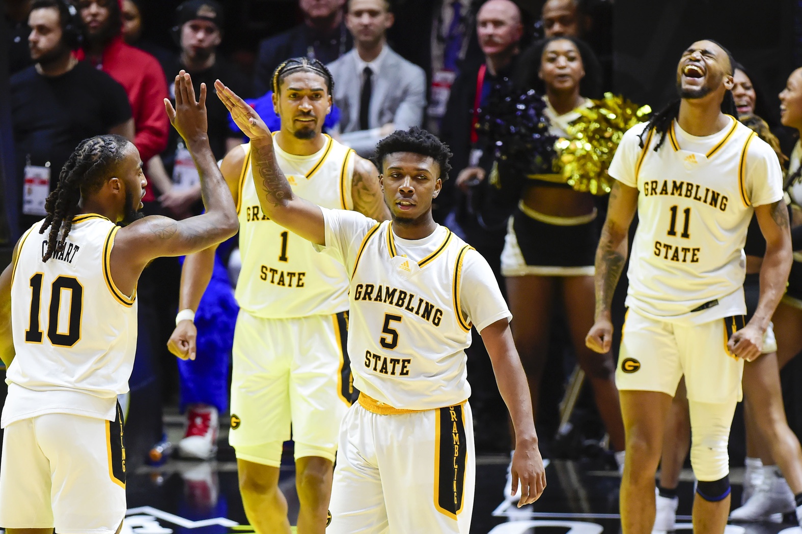 Feb 18, 2023; Salt Lake City, Utah, USA; Grambling State University Tigers guard Tra'Michael Moton (5) celebrates with guard Shawndarius Cowart (10) after making a basket against the Southern University Jaguars during overtime at the Jon M. Huntsman Center.