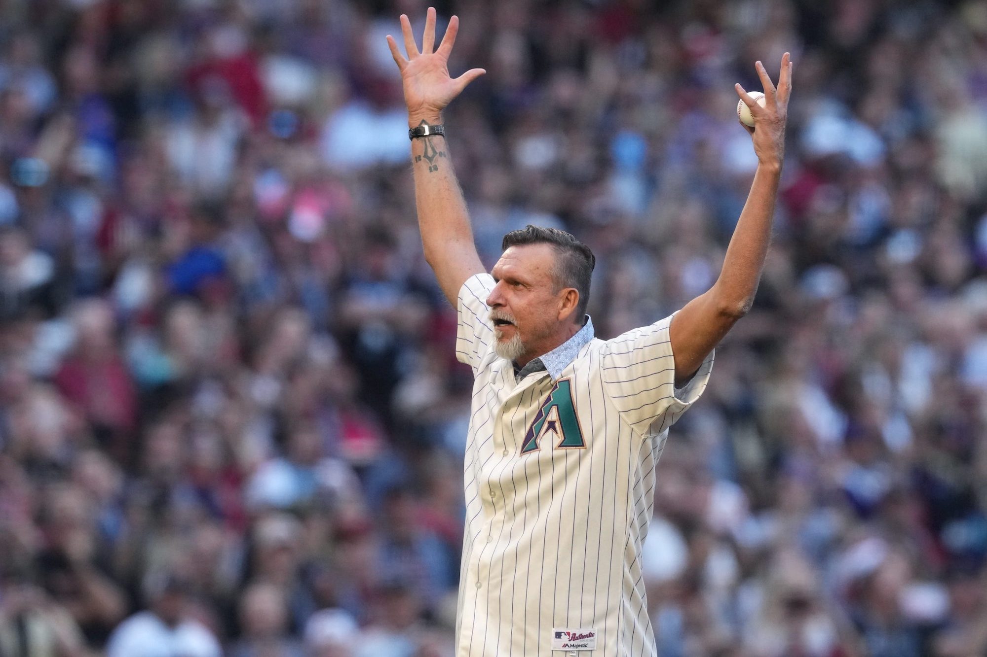 Former Arizona Diamondbacks pitcher and hall of fame member Randy Johnson throws out the ceremonial first pitch before game three of the 2023 World Series against the Texas Rangers at Chase Field on Oct. 30, 2023, in Phoenix, Arizona.