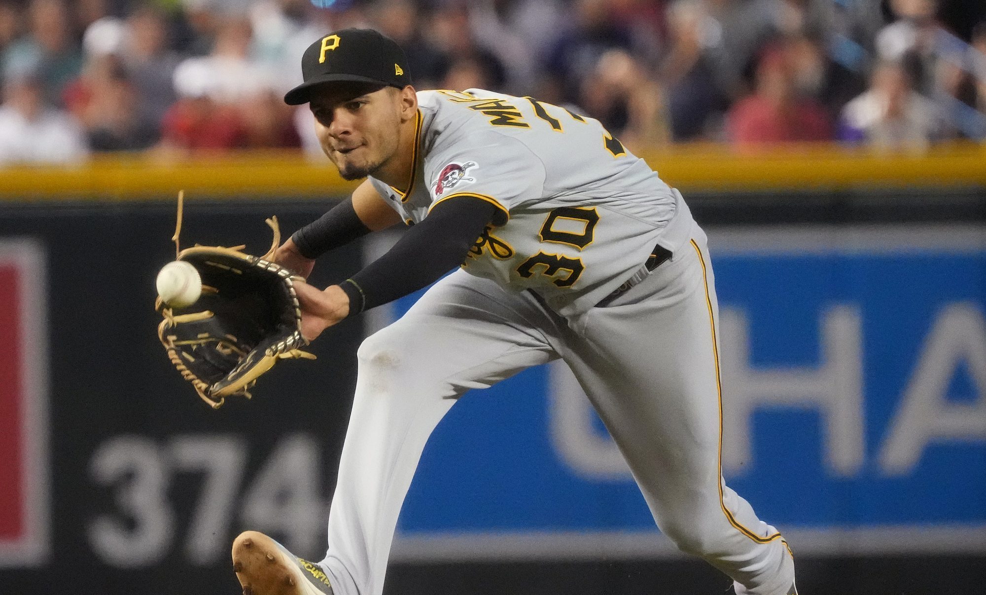 Jul 9, 2023; Phoenix, Arizona, USA; Pittsburgh Pirates Tucupita Marcano (30) fields a ground ball against the Arizona Diamondbacks at Chase Field.