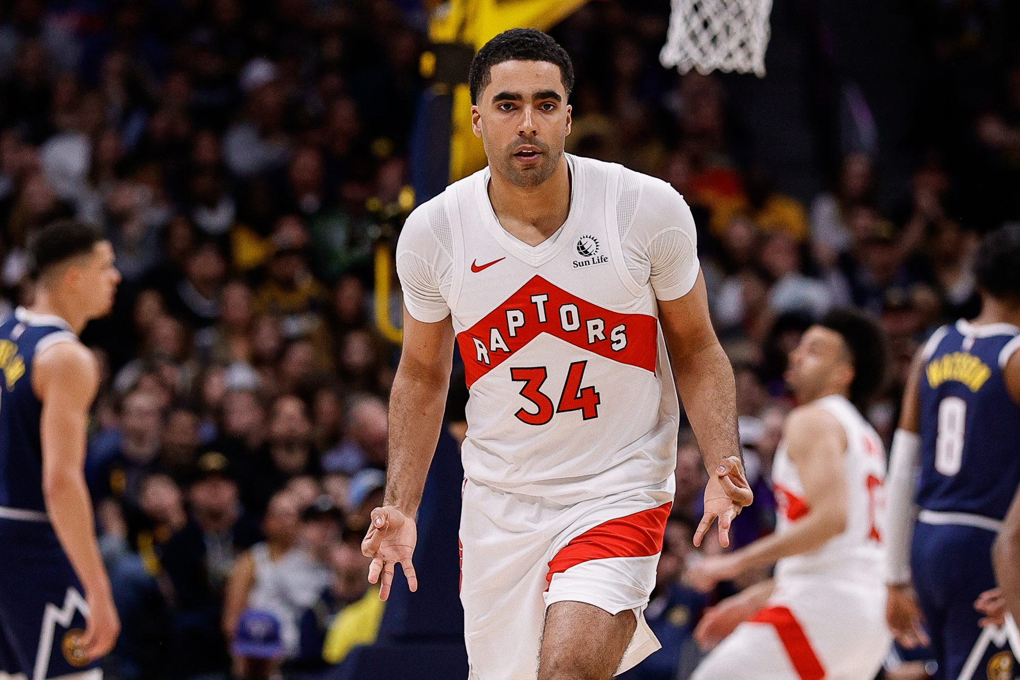 Mar 11, 2024; Denver, Colorado, USA; Toronto Raptors center Jontay Porter (34) reacts after a play in the third quarter against the Denver Nuggets at Ball Arena.