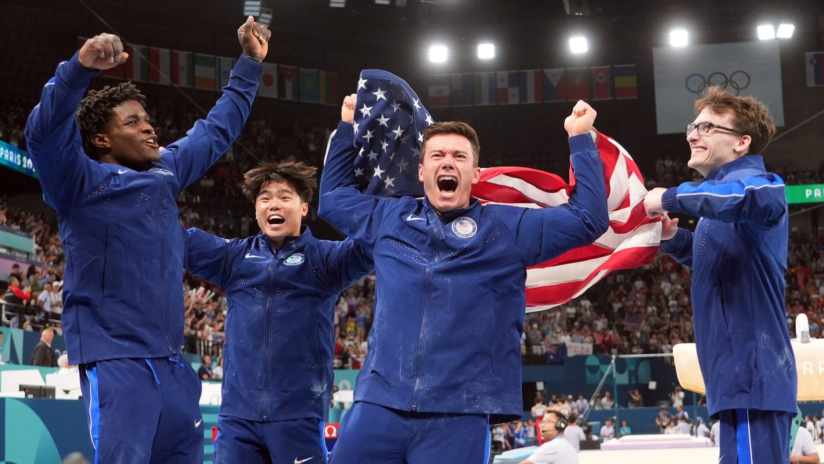 Jul 29, 2024; Paris, France; (from left to right) Frederick Richard, Asher Hong, Brody Malone, and Stephen Nedoroscik celebrate after winning bronze during the men’s team final during the Paris 2024 Olympic Summer Games at Bercy Arena