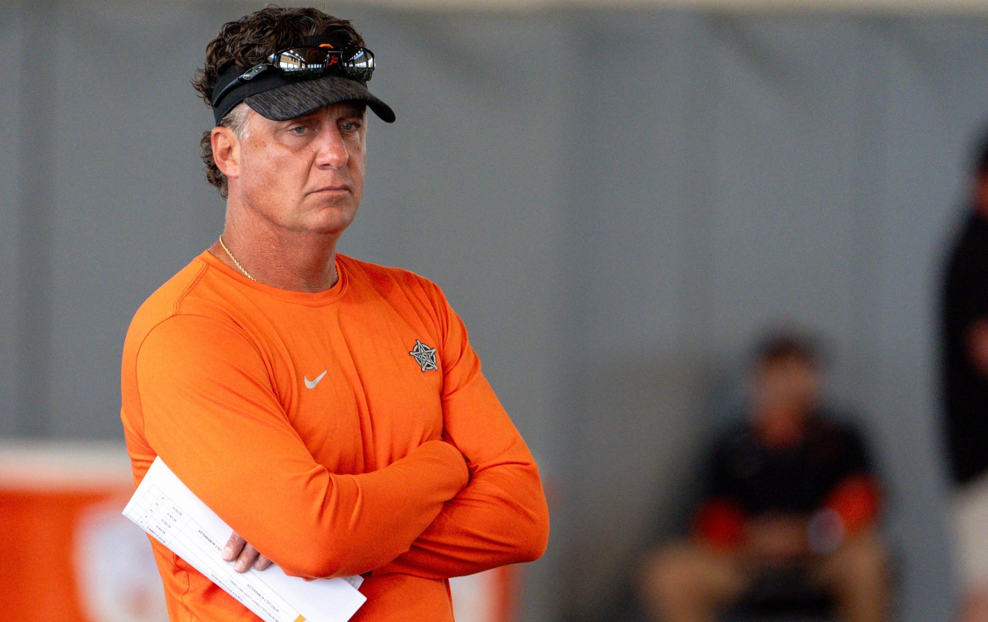 Head coach Mike Gundy walks on the field during an Oklahoma State football practice in Stillwater, Okla., on Saturday, Aug. 3, 2024.