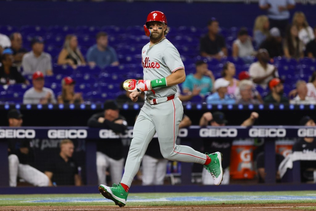 Sep 6, 2024; Miami, Florida, USA; Philadelphia Phillies first baseman Bryce Harper (3) scores against the Miami Marlins during the first inning at loanDepot Park.