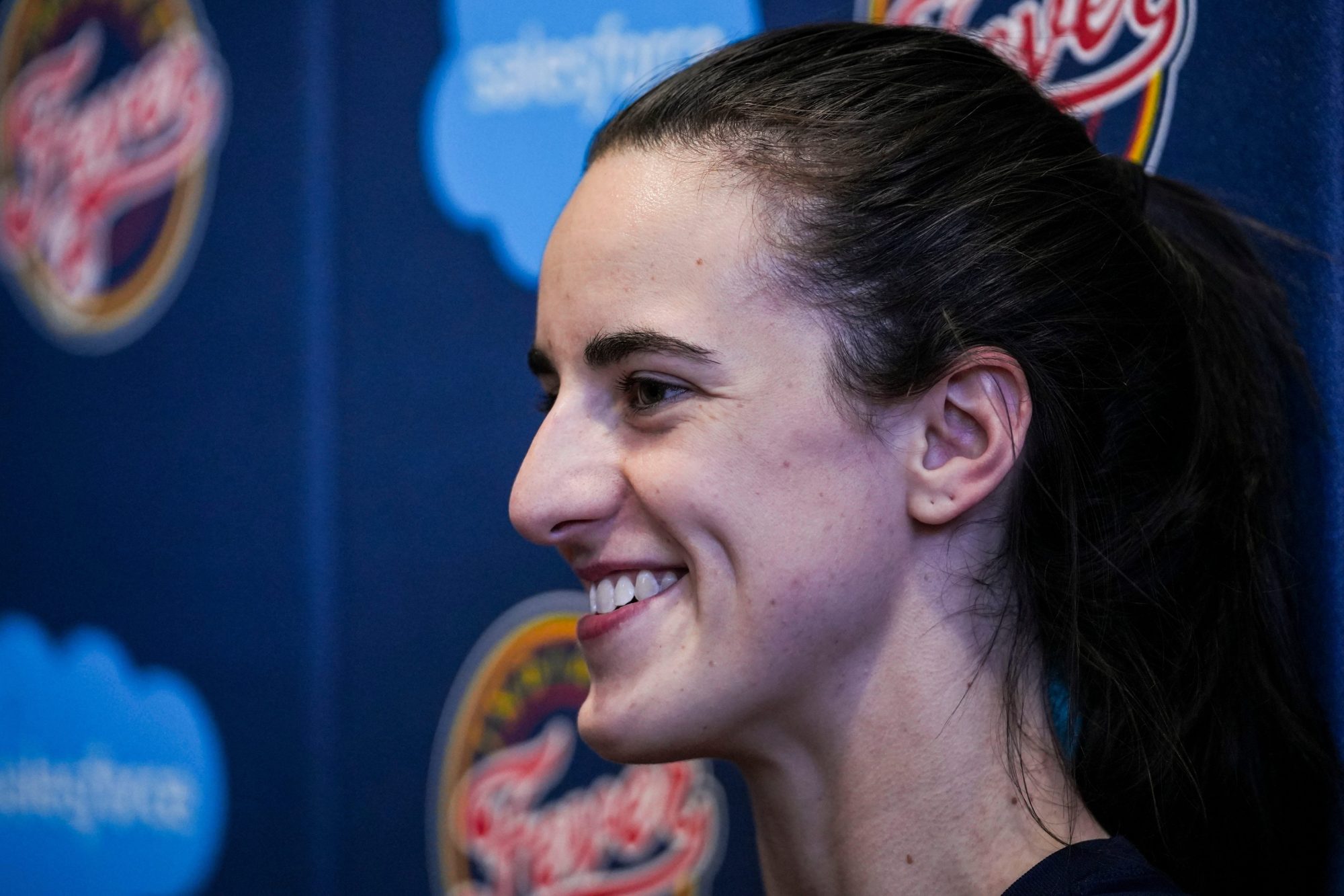 Indiana Fever guard Caitlin Clark (22) smiles while answering a question Tuesday, Sept. 17, 2024, after an Indiana Fever practice at Gainbridge Fieldhouse in Indianapolis.